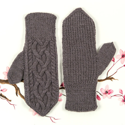 April Mittens, a heavily cabled Aran inspired hand knit mitten designed by Meghan Kelly in purple wool/mohair yarn.